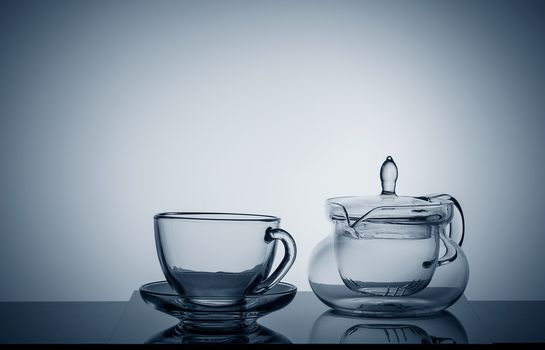 Set of different glass dishes, cup and teapot