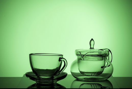 Set of different glass dishes, cup and teapot