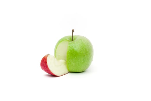 Color complementarity in a juicy green skin apple with a slice of red skin apple