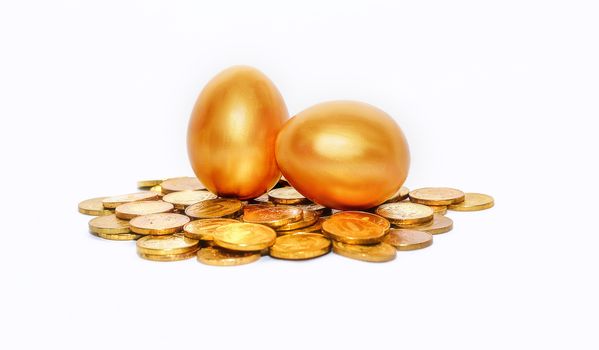 Gold coins and golden eggs, the concept of financial growth.