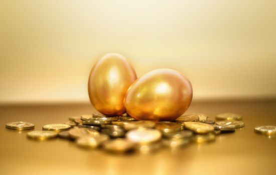 Gold coins and golden eggs, the concept of financial growth.