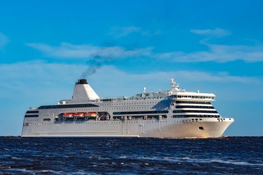 White cruise liner sailing on a clear day