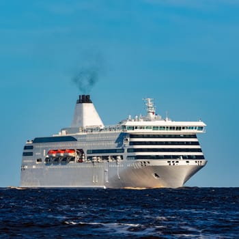 White cruise liner sailing on a clear day