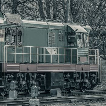 Old diesel cargo locomotive. Freight train in action