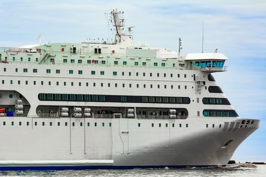 White cruise liner sailing on a clear day