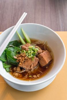 Noodle with pork stew in soy sauce soup