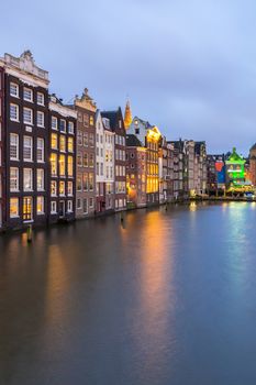 Amsterdam Canals and Saint Nicholas church at dusk Netherlands