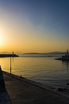 Fishermen at sunset in Alimos marina in Athens, Greece.