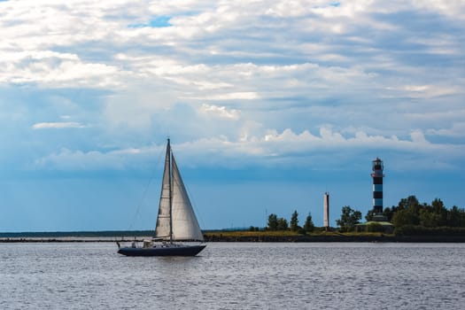 Blue sailboat in the travel by Europe. Sea journey