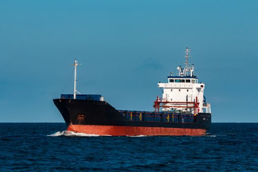 Black bulker ship. Logistics and merchandise transportations