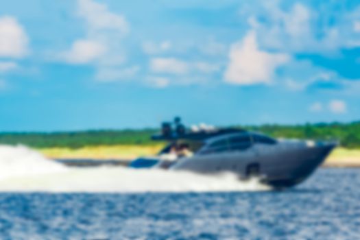 Speed boat - soft lens bokeh image. Defocused background