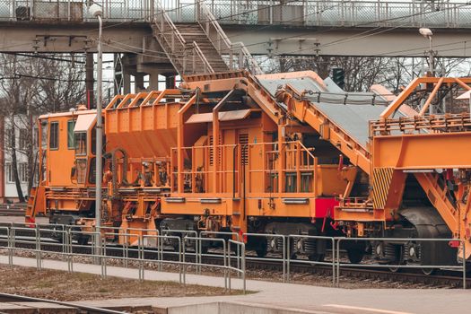 Ballast distributing and profiling track machine. Repair train