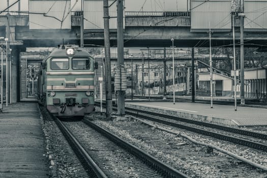 Old diesel cargo locomotive. Freight train in action