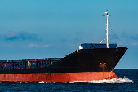 Black bulker ship. Logistics and merchandise transportations