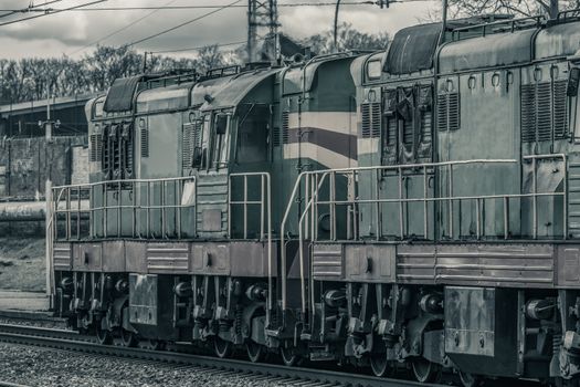 Old diesel cargo locomotive. Freight train in action