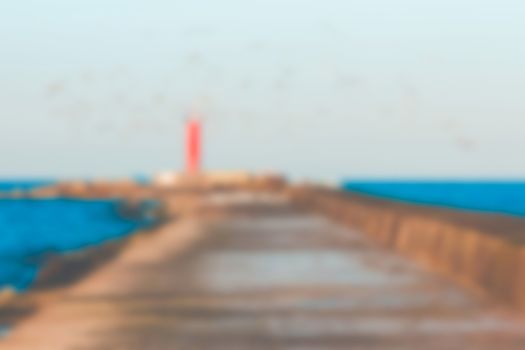 Red lighthouse - soft lens bokeh image. Defocused background