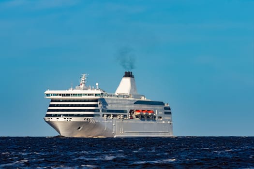 White cruise liner sailing on a clear day