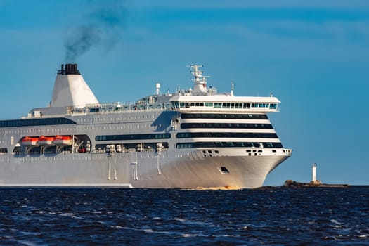 White cruise liner sailing on a clear day