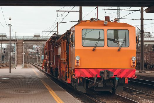 Ballast distributing and profiling track machine. Repair train