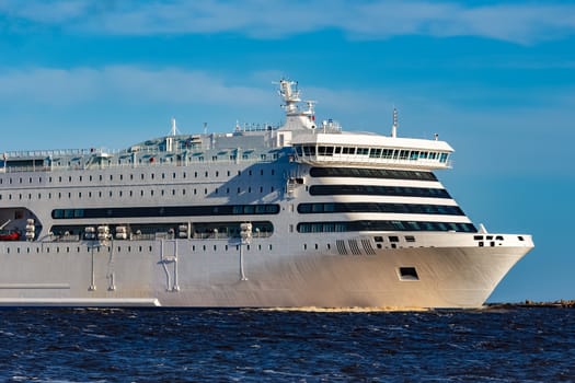 White cruise liner sailing on a clear day