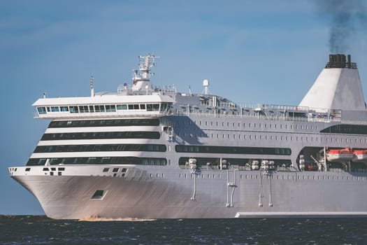 White cruise liner sailing on a clear day