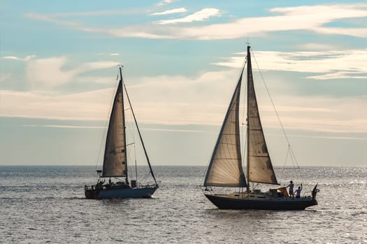 A fiew sailboats are traveling in Baltic sea. Summer journey