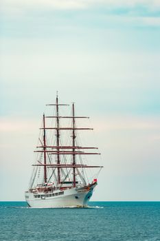 Big white sailing ship with three mast moving to the Riga port