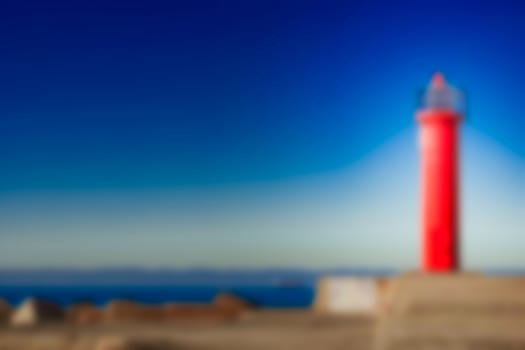 Red lighthouse - soft lens bokeh image. Defocused background