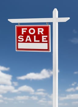 Left Facing For Sale Real Estate Sign on a Blue Sky with Clouds.