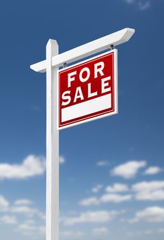 Right Facing For Sale Real Estate Sign on a Blue Sky with Clouds.