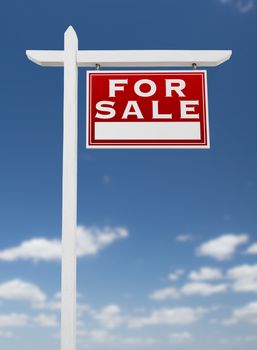 Right Facing For Sale Real Estate Sign on a Blue Sky with Clouds.