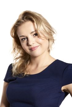 Studio portrait of attractive blonde young woman looking to the camera. 