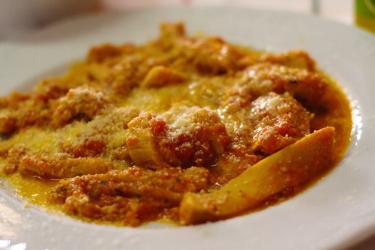 A plate of tripa a la romana in an italian restaurant