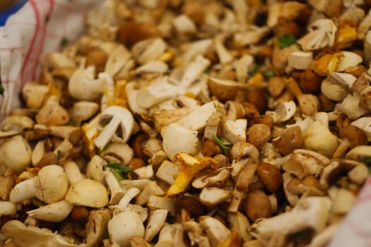 Sliced mushrooms at the market, different varieties