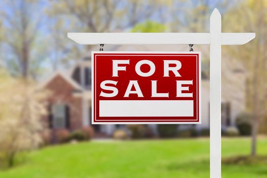 Left Facing For Sale Real Estate Sign In Front of House.