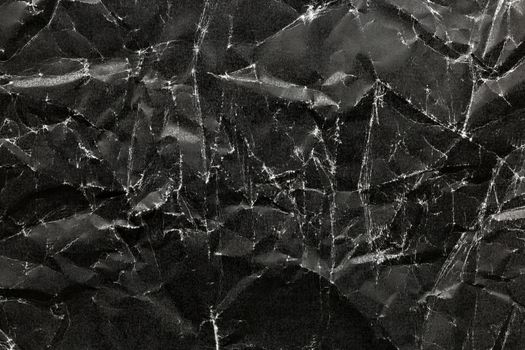 Black Crumpled Paper Background. Black crumpled paper texture.