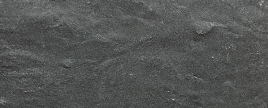 Dark grey ore black slate background or texture. Dark stone background, stone texture.
