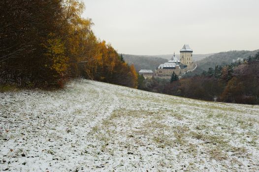 View of a snowy winter landscape with a castle Karlstejn