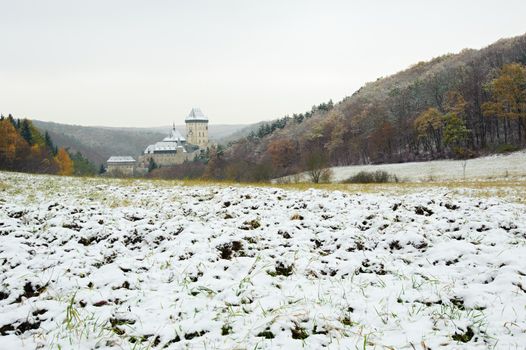 View of a snowy winter landscape with a castle Karlstejn