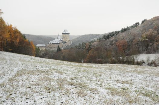 View of a snowy winter landscape with a castle Karlstejn