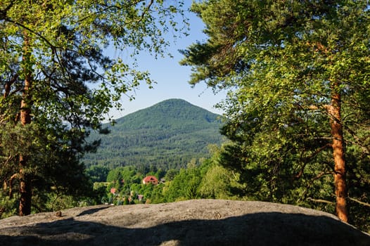 Summer landscape with forests, meadows rocks and sky