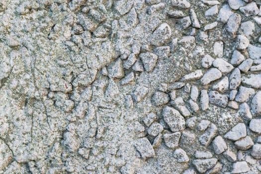 the texture of the stone in plaster red stones on a white background
