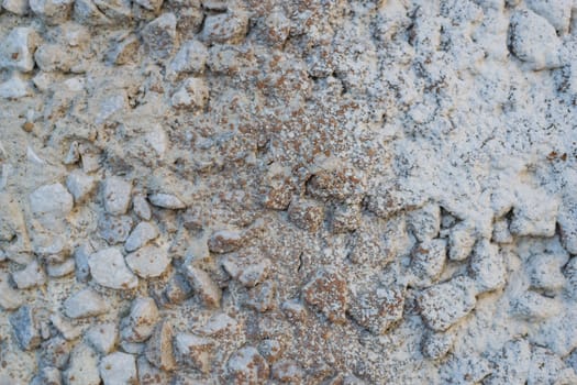 the texture of the stone in plaster red stones on a white background