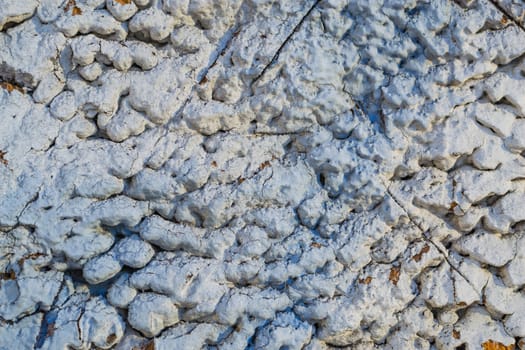 the texture of the stone in plaster red stones on a white background