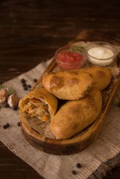 Different pies from meat and vegetables. Freshly baked cakes on a table