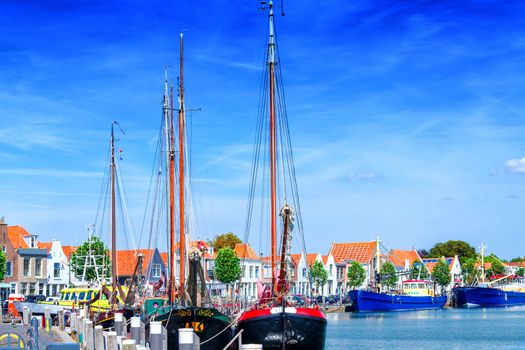 Dutch flat bottom boats, sailing boats in a harbor, in Holland Ziereksee. Province of Zeeland, The Netherlands.