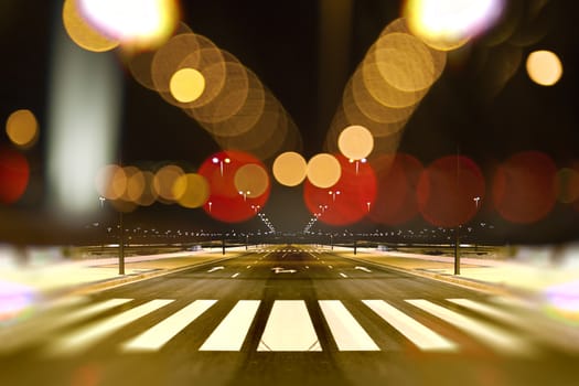 Empty street city at night and lamp post light flares.Road background