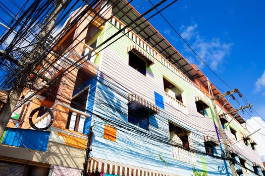 Thailand architecture.colorful facade.Light cables and light poles