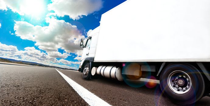 Truck and transport. Lorry delivering freight by road or highway