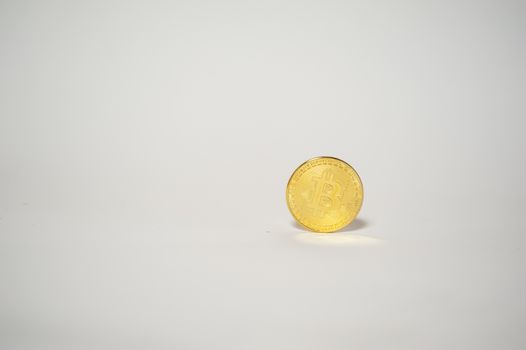 electronic money bitcoin over white background